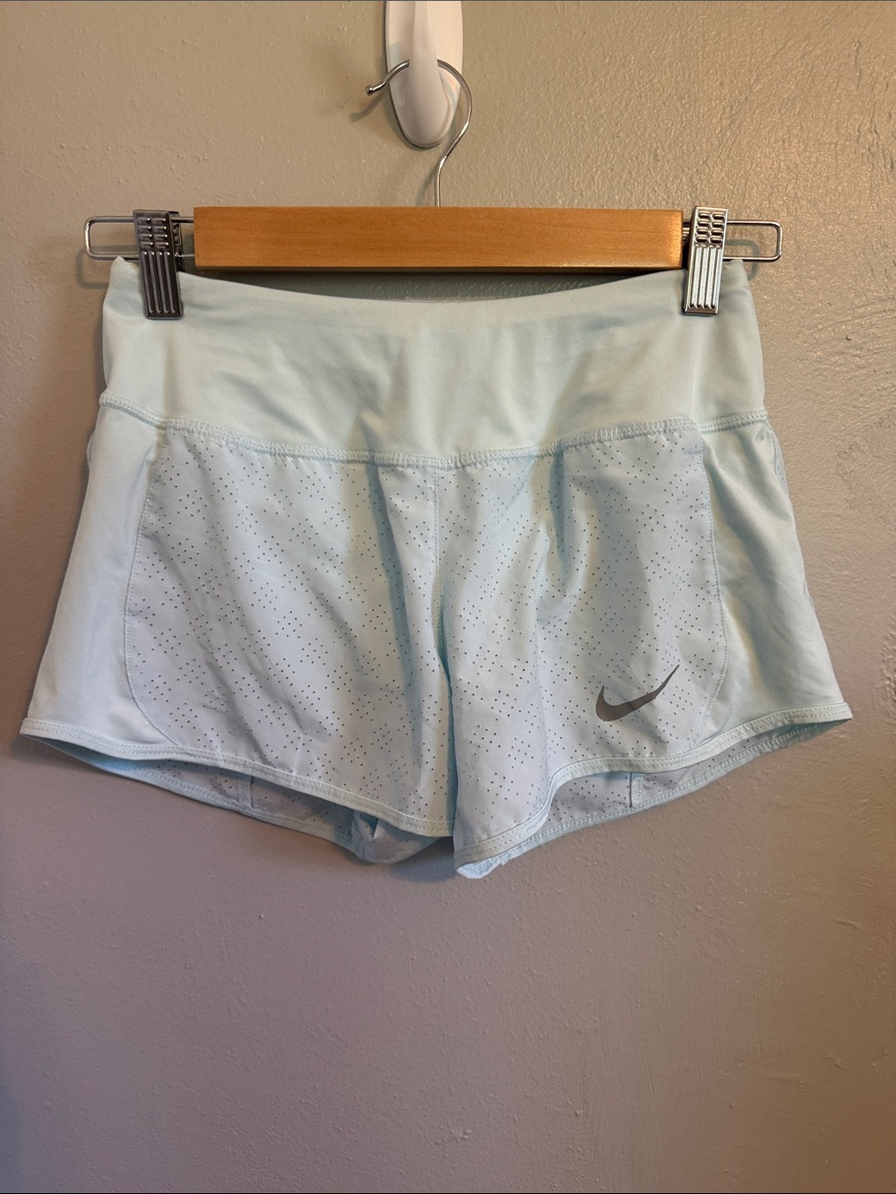 Nike light blue Dri-FIT running shorts with perforated detailing